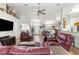 Bright and airy living room featuring modern furnishings, beautiful flooring, and an open layout at 10100 Se 69Th Ave, Belleview, FL 34420