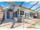 View of screened-in pool with patio and outdoor grill area at 10100 Se 69Th Ave, Belleview, FL 34420