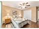 Bedroom featuring wood floors, a ceiling fan, a picture, and a large closet at 1029 Sw 157Th Ln, Ocala, FL 34473