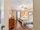 Cozy bedroom featuring wood floors, a large bed, a dresser, and natural lighting at 1029 Sw 157Th Ln, Ocala, FL 34473