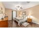 Bedroom with wood floors featuring a ceiling fan, and stylish furnishings at 1029 Sw 157Th Ln, Ocala, FL 34473