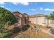 Landscaped front of the home featuring decorative rock and pathway at 1029 Sw 157Th Ln, Ocala, FL 34473