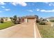 Charming single-story home featuring a well-manicured lawn and two-car garage with decorated driveway at 1029 Sw 157Th Ln, Ocala, FL 34473