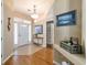 Inviting foyer featuring a decorative light fixture, tile accents, and light-colored walls at 1029 Sw 157Th Ln, Ocala, FL 34473