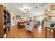 Open living room with wood floors, neutral walls, and a sliding glass door to the lanai at 1029 Sw 157Th Ln, Ocala, FL 34473