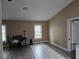 Neutral living room with light-colored tile and wood flooring at 11 Pecan Pass Loop, Ocala, FL 34472