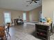 Open concept living room showcasing hardwood floors, two windows, and a high, vaulted ceiling at 11 Pecan Pass Loop, Ocala, FL 34472