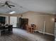 Large living room with lots of space and a ceiling fan at 11 Pecan Pass Loop, Ocala, FL 34472