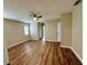 Cozy bedroom featuring modern flooring, neutral walls, and a ceiling fan at 11484 Sw 76Th Cir, Ocala, FL 34476