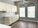 Bright kitchen area with lots of cabinets and natural light from the arched windows at 11484 Sw 76Th Cir, Ocala, FL 34476