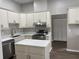 Modern kitchen featuring stainless steel appliances, stylish cabinets, and quartz countertops at 11484 Sw 76Th Cir, Ocala, FL 34476