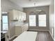 Bright kitchen area with lots of cabinets and natural light, showing the kitchen counter at 11484 Sw 76Th Cir, Ocala, FL 34476