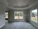 Bedroom showcasing windows providing natural light and an open doorway at 13418 Sw 60Th Court Rd, Ocala, FL 34473