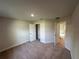 Bedroom featuring neutral walls, plush carpet, and a closet with ample storage space at 13418 Sw 60Th Court Rd, Ocala, FL 34473