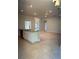 View of kitchen island that opens to the living room with carpet flooring and neutral walls at 13418 Sw 60Th Court Rd, Ocala, FL 34473