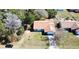 Aerial view of the house showing roof, driveway, and surrounding greenery at 13718 Sw 40Th Cir, Ocala, FL 34473