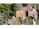 Overhead view of a well-maintained home with a brown roof and surrounding landscaping at 13718 Sw 40Th Cir, Ocala, FL 34473