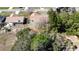 Aerial perspective of the property showcasing its brown roof, trees, and outdoor space at 13718 Sw 40Th Cir, Ocala, FL 34473