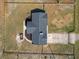 A top-down aerial view of the home with a fenced yard and a long driveway at 13800 Se 80Th Ave, Summerfield, FL 34491