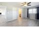 Bedroom showcasing new hardwood flooring, ceiling fan and access to the bathroom at 13800 Se 80Th Ave, Summerfield, FL 34491