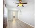 Bedroom showcasing new hardwood flooring, ceiling fan and closet door at 13800 Se 80Th Ave, Summerfield, FL 34491