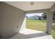 View of a house from a porch with a concrete floor and painted walls at 1482 Ne 160Th Pl, Citra, FL 32113