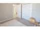 Bedroom with plush gray carpet, white closet doors, and neutral walls at 1482 Ne 160Th Pl, Citra, FL 32113