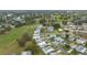 Aerial view of residential neighborhood with manicured lawns and golf course in the distance at 1541 Hillcrest Dr, Lady Lake, FL 32159