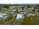 Aerial view showing the property nestled in a well-established neighborhood with mature trees at 1541 Hillcrest Dr, Lady Lake, FL 32159