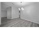 Bright dining room with modern chandelier and wood-look flooring at 1541 Hillcrest Dr, Lady Lake, FL 32159