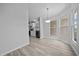 Bright dining room with stainless steel appliances in the kitchen at 1541 Hillcrest Dr, Lady Lake, FL 32159