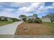 Charming single-story home with a well-manicured lawn and long driveway at 1541 Hillcrest Dr, Lady Lake, FL 32159