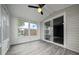 Sunroom with a ceiling fan and a sliding glass door at 1541 Hillcrest Dr, Lady Lake, FL 32159