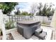 Close-up of a well-maintained hot tub in a private backyard setting, featuring a step stool for access at 1655 Sunnyside Dr, Maitland, FL 32751