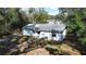 Large backyard surrounded by mature trees at 18 Juniper Pass Crse, Ocala, FL 34480