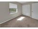 Cozy bedroom with plush carpeting, natural light, and closet space at 18 Juniper Pass Crse, Ocala, FL 34480