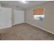 Bedroom with window, neutral carpet, and large closet at 18 Juniper Pass Crse, Ocala, FL 34480