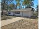 Inviting one-story home with attached garage and a concrete driveway at 18 Juniper Pass Crse, Ocala, FL 34480