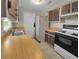 Functional kitchen features tile flooring and wood countertops at 18 Juniper Pass Crse, Ocala, FL 34480