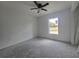 Bedroom with a window offering natural light, providing a comfortable and inviting space at 19 Bay Court Pass, Ocklawaha, FL 32179