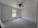 Bedroom featuring a ceiling fan, a window with lots of natural light, and plenty of space at 19 Bay Court Pass, Ocklawaha, FL 32179