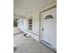 Covered entryway featuring a modern entry door at 19 Bay Court Pass, Ocklawaha, FL 32179