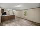 Bright and airy living room featuring modern vinyl flooring and a neutral color palette at 21055 Highway 441 N, Micanopy, FL 32667