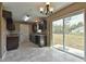 View of the kitchen with dark wood cabinets and large sliding glass doors to the backyard at 23293 Nw Mallard Ave, Dunnellon, FL 34431