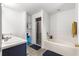 Bathroom featuring a soaking tub, glass shower, and open shelving at 29 Guava Pass, Ocklawaha, FL 32179