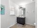 Bathroom featuring a vanity with a dark wood base and tiled floors at 29 Guava Pass, Ocklawaha, FL 32179