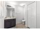 White bathroom with a modern sink and tile floors at 29 Guava Pass, Ocklawaha, FL 32179