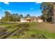 Inviting one-story home with an attached garage and arched entry, set on a spacious, well-manicured lawn at 29 Guava Pass, Ocklawaha, FL 32179