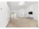 Open living room with bright natural light from slider, neutral paint, and open concept floorplan to dining at 29 Guava Pass, Ocklawaha, FL 32179