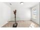 Bright living room featuring a large window letting in plenty of light and a glass table as a focal point at 29 Guava Pass, Ocklawaha, FL 32179